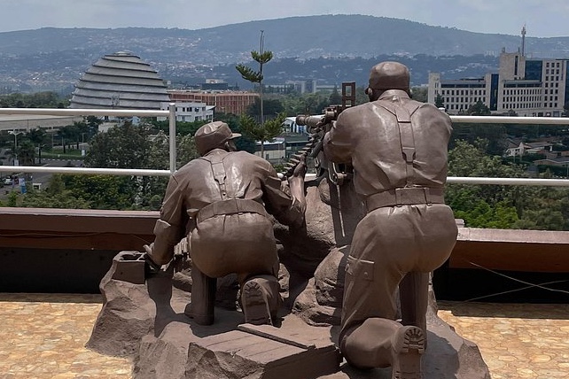Soldier statues at the Campaign Against Genocide Museum with the Kigali Convention Centre behind, on the Kigali Past and Present group tour